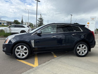 The 2015 Cadillac SRX Premium Collection, shown in Sapphire Blue Metallic, delivers confident perfor... (image 4)