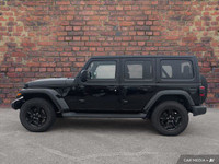 Check out this 2023 Jeep Wrangler Sahara Altitude before someone takes it home! *This Jeep Wrangler... (image 1)