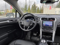 This Ford Fusion Hybrid boasts a Gas/Electric I-4 2.0 L/122 engine powering this Variable transmissi... (image 8)