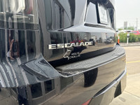 The 2021 Cadillac Escalade Luxury in Dark Moon Blue Metallic makes a bold statement with its 22-inch... (image 5)