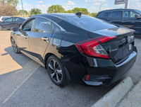 The 2016 Honda Civic Touring (VIN: 2HGFC1F9XGH111613) is a refined compact sedan that delivers a str... (image 4)