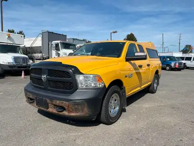 2015 RAM 1500 Tradesman Quad Cab 4WD, with canopy and rear bed slide, 5.7L V8 OHV 16V engine, 8 cyli...