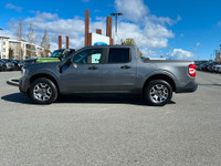 This 2022 Ford Maverick XL has an Carbonized Grey Exterior and Black Onyx Med Interior with seating... (image 2)