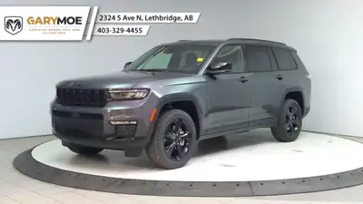 The 2025 Jeep Grand Cherokee L Limited 4x4, in a sophisticated gray, is designed to offer a commandi...