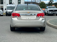 This 2013 Chevrolet Cruze has a Grey exterior and Grey seats with seating for 5. Equipped with a 1.4... (image 5)