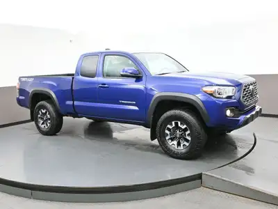 Introducing the sleek blue 2023 Toyota Tacoma. This truck is packed with various features to make yo...