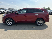 This 2019 Kia Sorento is finished in striking Passion Red Metallic with a refined Black interior, of... (image 4)
