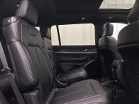 The 2025 Jeep Grand Cherokee L Limited 4x4 in sophisticated gray with its smooth 4x4 drivetrain prom... (image 7)