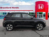 This 2022 Hyundai Venue Trend SUV boasts a sleek Space Black exterior and a practical, comfortable b... (image 6)