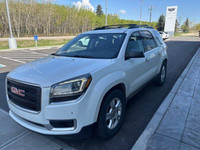 The 2016 GMC Acadia SLE is a versatile and family-friendly SUV, presented in a clean Summit White ex... (image 2)