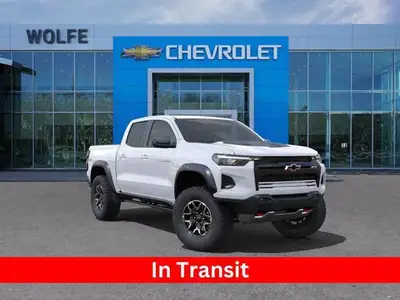 The 2025 Chevrolet Colorado ZR2, presented in Summit White with a Jet Black/Artemis interior, is eng...
