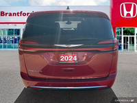 Command attention with this 2024 Chrysler Pacifica Touring-L, boasting a stunning Red Hot Pearl Coat... (image 4)