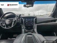 The 2019 Cadillac Escalade includes four-wheel drive, an adaptive air suspension, and power retracta... (image 9)