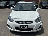 This 2014 Hyundai Accent Sedan is a reliable and stylish choice! With its sleek white exterior and c... (image 1)