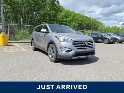 Experience the commanding presence and versatile functionality of this 2015 Hyundai Santa Fe XL Luxu...