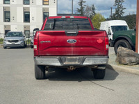 This 2015 Ford F-150 XLT has a Ruby Red Metallic exterior and Grey Cloth Interior with seating for 5... (image 5)