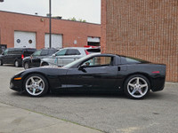 This isn’t just a car—it’s a statement. Draped in sleek black-on-black with polished chrome wheels t... (image 4)