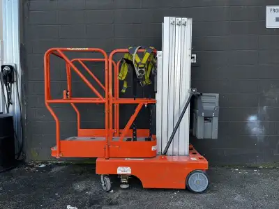 2000 JLG 12SP Electric Man Lift, orange exterior. This item is currently OFFSITE. You must register...