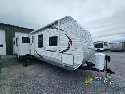 The 33RLDS Jay Flight travel trailer by Jayco offers triple slides and a rear entertainment center....