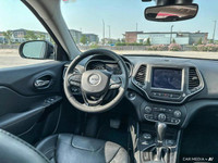 The 2023 Jeep Cherokee Altitude in Diamond Black Crystal Pearlcoat features premium leather-faced se... (image 9)