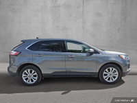 This 2024 Ford Edge Titanium AWD, presented in a sophisticated *Gray* finish, offers a compelling bl... (image 1)