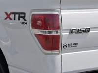 The 2014 Ford F-150 in pristine white is a robust 4x4 truck designed for those who demand power and... (image 8)