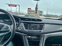The 2023 Cadillac XT5 includes a hands-free liftgate, panoramic roof, heated front seats, and leathe... (image 9)