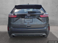 This 2024 Ford Edge Titanium AWD, presented in a sophisticated *Gray* finish, offers a compelling bl... (image 5)