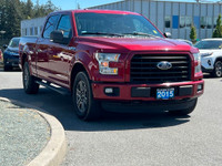 This 2015 Ford F-150 XLT has a Ruby Red Metallic exterior and Black Sport Interior with seating for... (image 9)