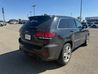 The 2014 Jeep Grand Cherokee SRT8 is a high-performance SUV that blends raw muscle, refined luxury,... (image 3)