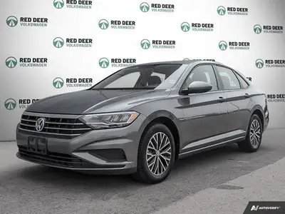 Meet the 2021 Volkswagen Jetta Comfortline in a stunning gray finish, featuring a Front-Wheel Drive...