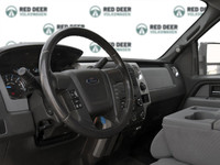 The 2014 Ford F-150 in pristine white is a robust 4x4 truck designed for those who demand power and... (image 9)