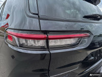 The 2024 Jeep Grand Cherokee L Limited 4x4 in striking Diamond Black Crystal Pearl is a sophisticate... (image 8)