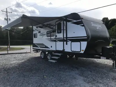 The 2024 Grand Design Imagine 17MKE is a compact and lightweight travel trailer designed for couples...