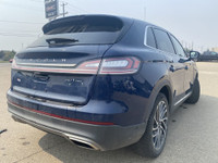 Under the glistening Rhapsody Blue exterior, the 2019 Lincoln Nautilus Reserve stands as a testament... (image 7)