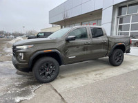 The 2024 GMC Canyon Elevation in Deep Bronze Metallic is a rugged and capable mid-size truck. Its bo... (image 3)
