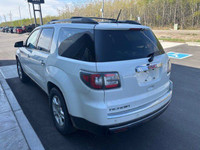 The 2016 GMC Acadia SLE is a versatile and family-friendly SUV, presented in a clean Summit White ex... (image 4)
