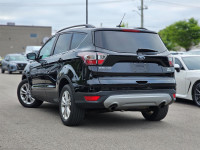 Step into the 2017 Ford Escape SE, a black, front-wheel drive SUV that delivers consistent handling... (image 1)
