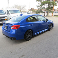 Check out this stylish 2015 Subaru WRX Premium sedan with a sleek blue exterior and a comfortable bl... (image 6)