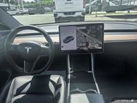 This Tesla Model 3 delivers a Electric engine powering this Automatic transmission. Window Grid Ante... (image 9)