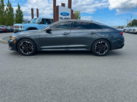 This 2021 Kia K5 GT-Line has a Grey Exterior and Black Interior with seating for 5. Equipped with a... (image 1)