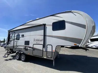 The Wildcat Maxx 242RLX half ton fifth wheel by Forest River offers double slide outs and a u-shaped...