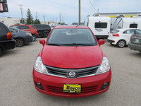 All our listed prices are cash price plus tax. 2010 Nissan Versa SL comes with Cloth Interior, Tract... (image 1)
