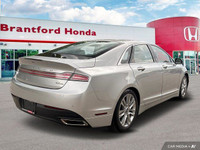 Experience effortless elegance with this 2016 Lincoln MKZ. Boasting a sleek silver exterior and a me... (image 5)