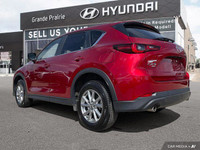 Experience the thrill of confident driving with this 2025 Mazda CX-5 PREF, boasting a sleek red exte... (image 3)