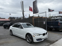 This 2014 BMW 320 is a sleek and reliable sedan that's sure to turn heads. With its stylish white ex... (image 3)