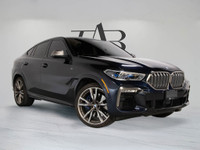This 2020 BMW X6 M50i Coupe commands attention with aggressive styling, a powerful V8 engine, and re... (image 1)
