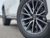 The 2022 Lexus NX NX 350h is presented in pristine white and features an AWD drivetrain, ensuring op... (image 2)