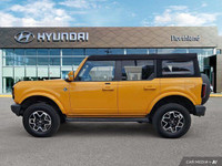 Turn heads and conquer any terrain in this vibrant 2021 Ford Bronco! This eye-catching yellow conver... (image 1)