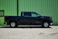 This 2023 GMC Sierra 1500 is for sale today. This crew cab 4X4 pickup has 70,286 kms. It's black in... (image 1)